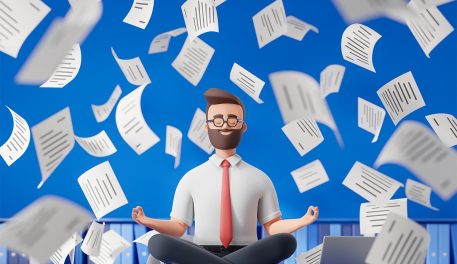 Digital image of a business man meditating as papers float around him.