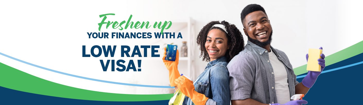 Happy couple standing back to back holding a combination of cleaning supplies and a Benchmark FCU VISA credit card.